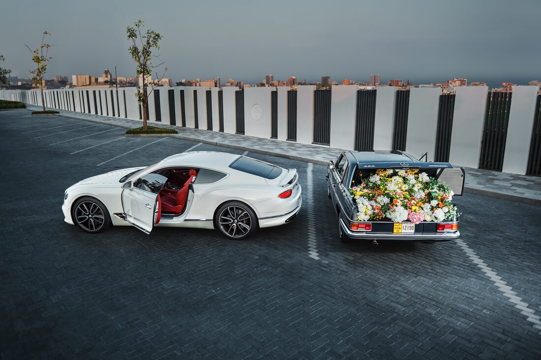 Flower Corner's classic wedding car dressed with fresh flowers